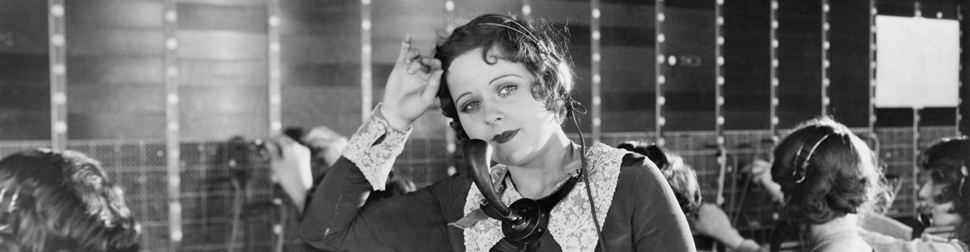 Cover photo of a telephone operator from the 1920s