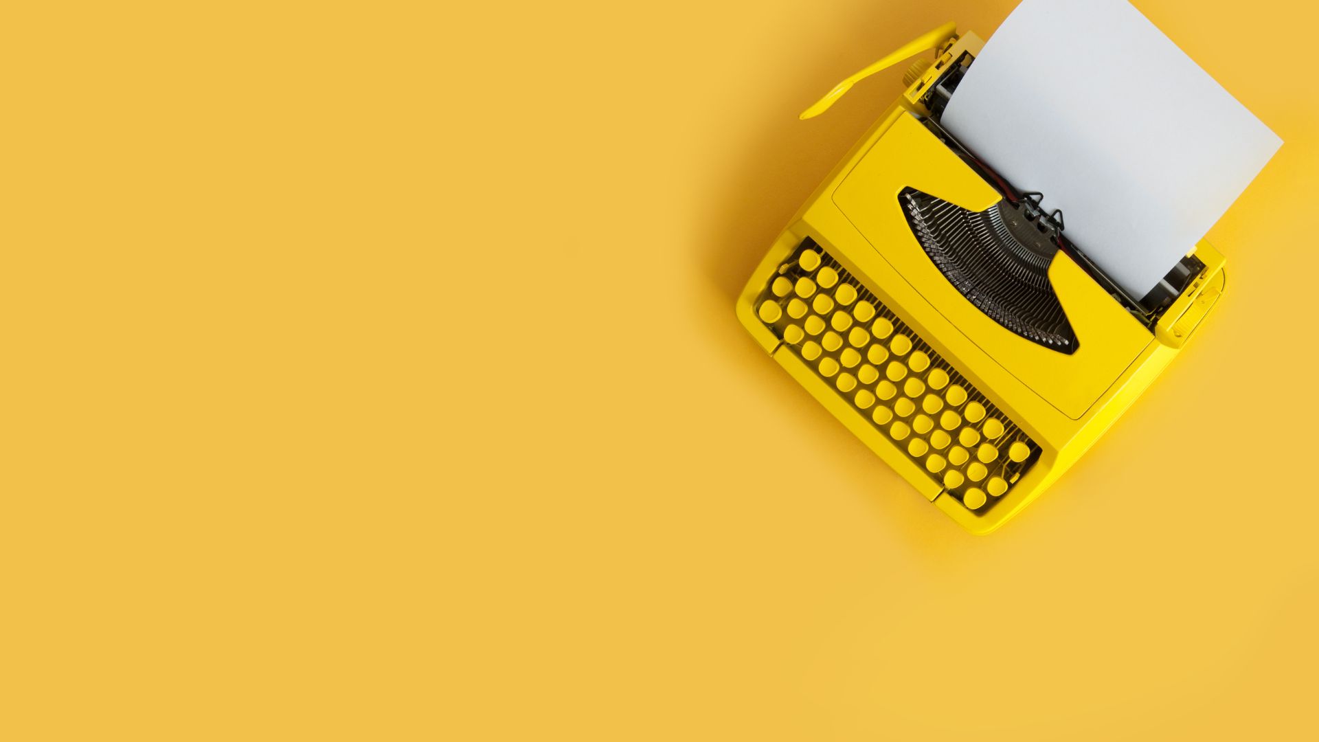 Cover photo of a yellow typewritter